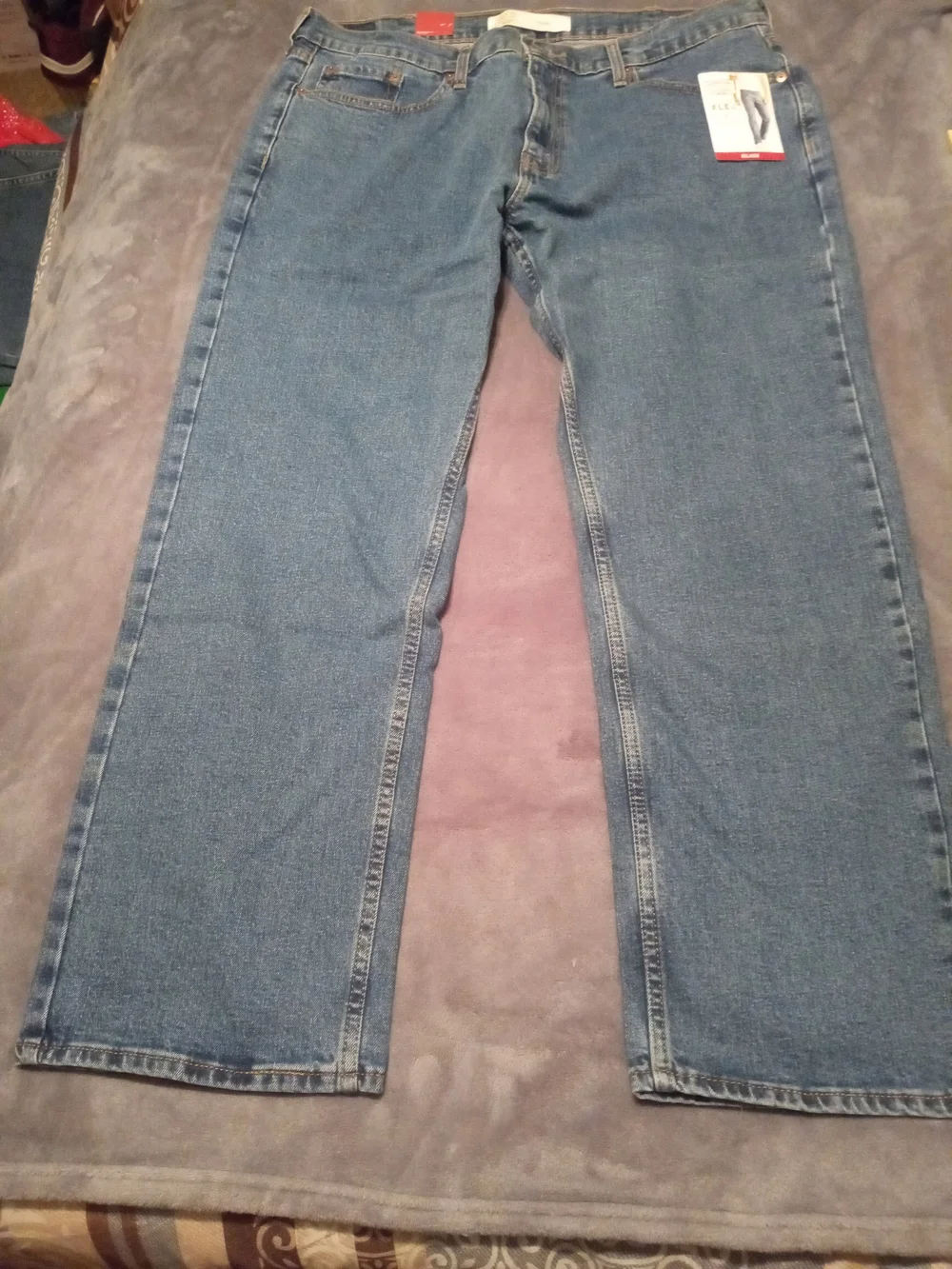 Levi's Signature Relaxed Fit Jeans in Blue with Brown Patch